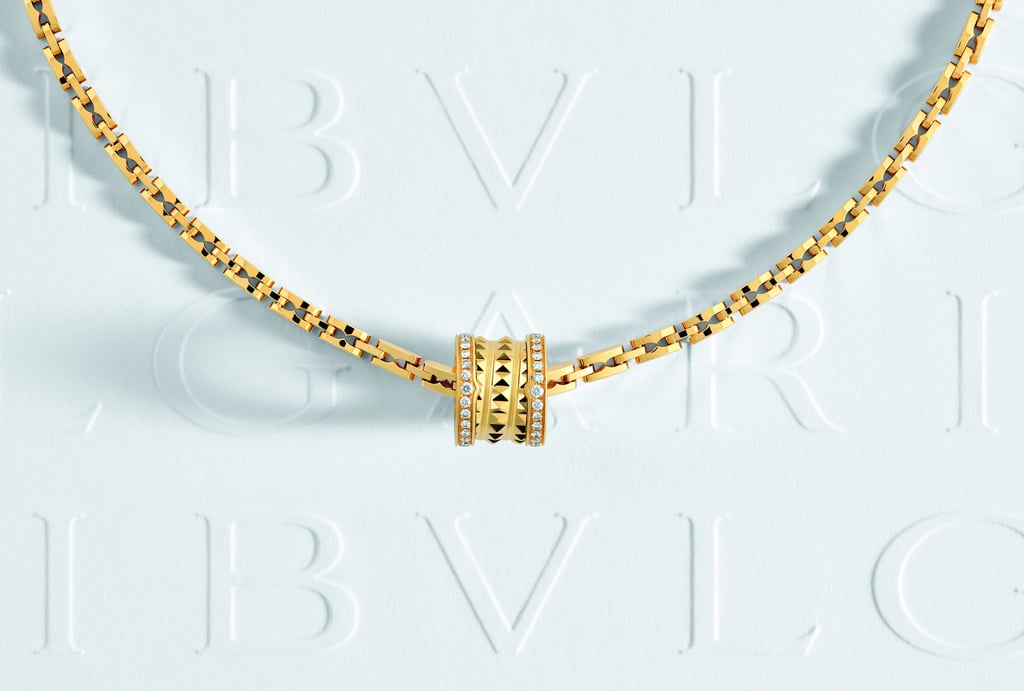 A B.Zero1 ring hanging on a B.Zero1 necklace. A B.Zero1 ring hanging on a B.Zero1 necklace.