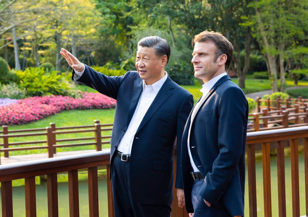 Chinese President Xi Jinping and French President Emmanuel Macron chatting in the Pine Garden in Guangzhou on Friday. Photo: EPA-EFE/Xinhua Chinese President Xi Jinping and French President Emmanuel Macron chatting in the Pine Garden in Guangzhou on Friday. Photo: EPA-EFE/Xinhua