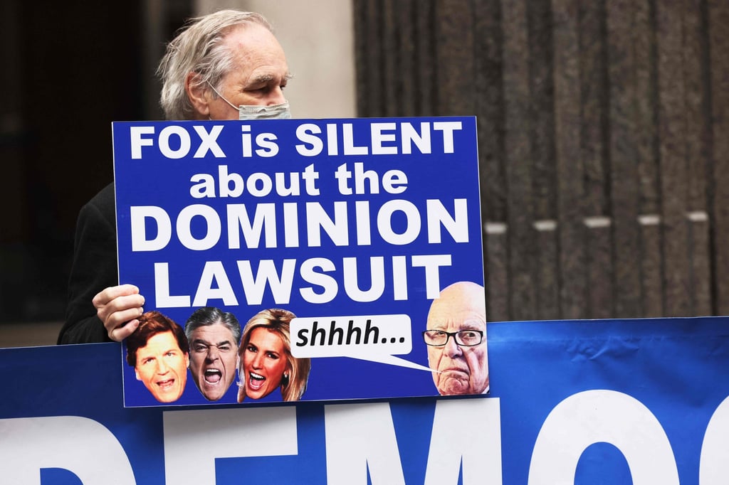 A member of Rise and Resist participates in its weekly “Truth Tuesday” protest at News Corp headquarters in New York City. Photo: AFP