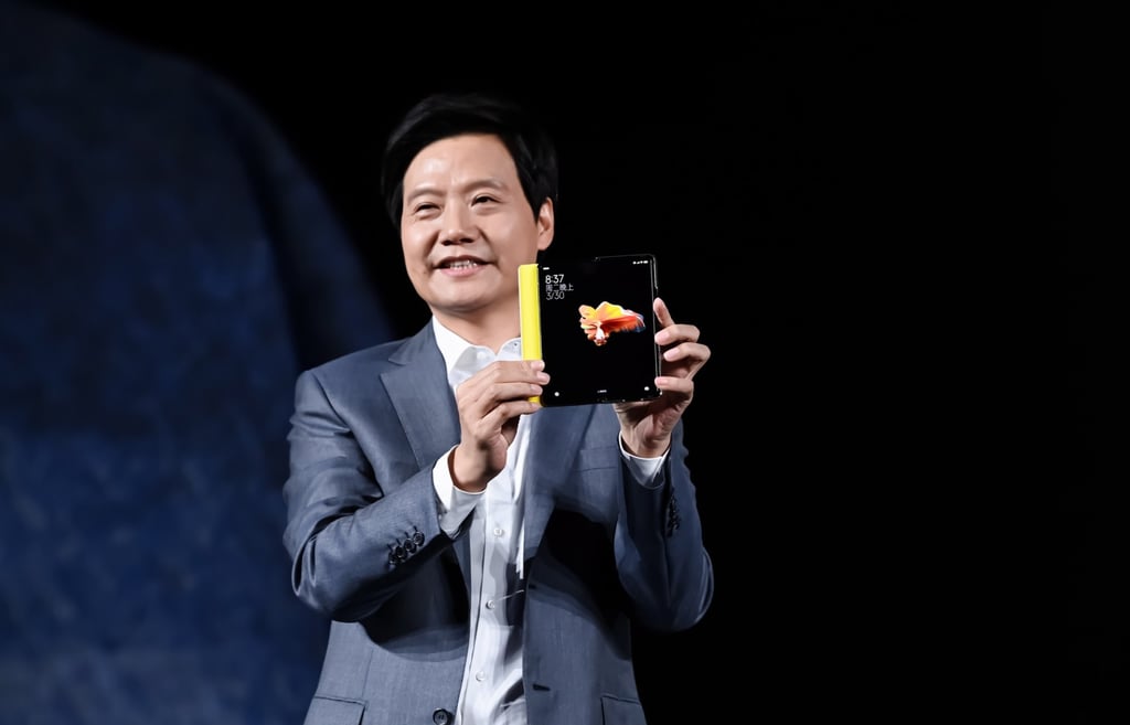 Lei Jun, co-founder and CEO of Xiaomi, demonstrates a foldable smartphone during a product unveiling event in Beijing in March 2021. Photo: Handout