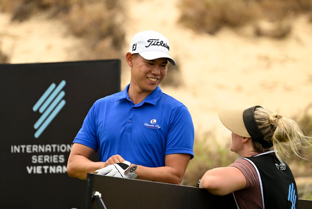 Matthew Cheung shares a smile with wife Kaitlin, who is caddying for him this week at the International Series Vietnam. Photo: Asian Tour