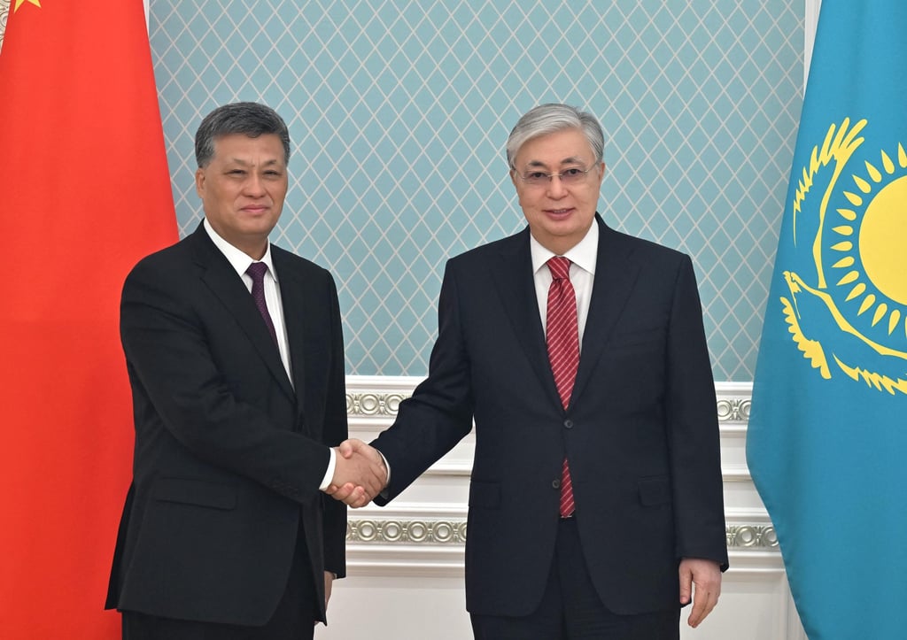 Xinjiang party chief Ma Xingrui shakes hands with Kazakh President Kassym-Jomart Tokayev during a meeting in Astana last month. Photo: AFP