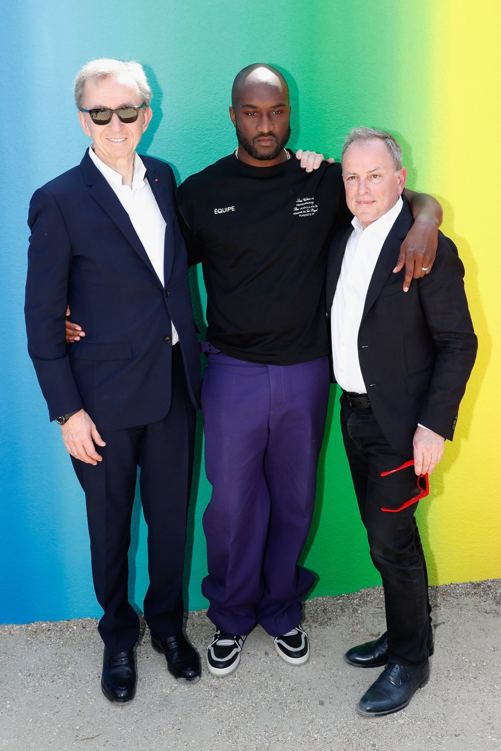 Owner of LVMH luxury group Bernard Arnault, late stylist Virgil Abloh and then-CEO of Louis Vuitton Michael Burke pose after the Louis Vuitton menswear spring/summer 2019 show as part of Paris Fashion Week in June 2018, in Paris, France. Photo: Getty Images
