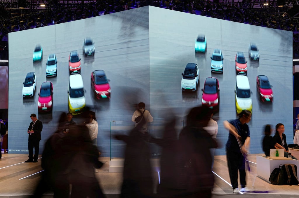 A screen shows cars at the Volkswagen booth at the Shanghai Auto Show on Tuesday. Photo: Reuters