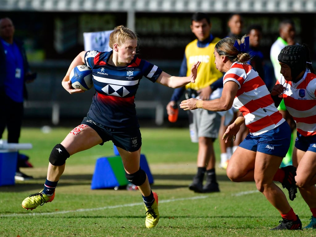 Hong Kong’s Rosie Wright fends off the Paraguay defence during her side’s last game in Pool D at the HSBC World Rugby Sevens Challenger Series tournament in Stellenbosch. Photo: Handout