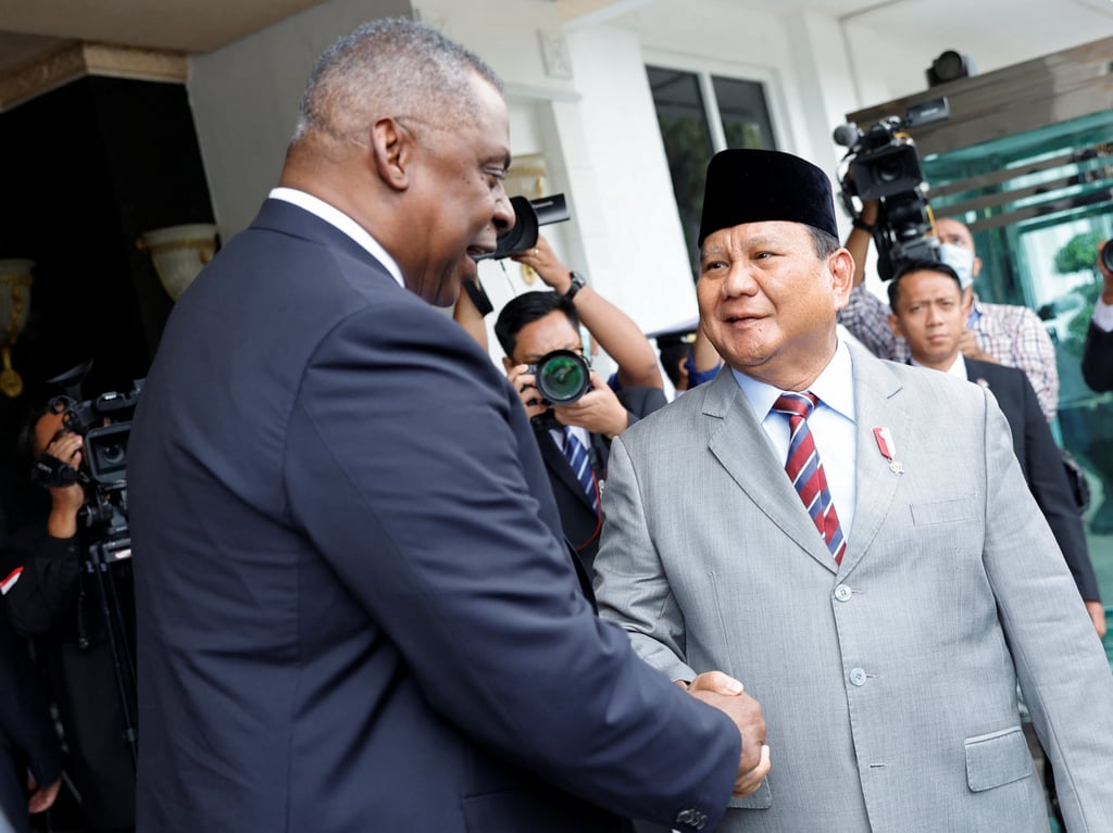 Indonesia’s Defence Minister Prabowo Subianto, seen shaking hands with US Defence Secretary Lloyd Austin, is considered one of the front runners for the 2024 Indonesian election. Photo: Reuters/Pool