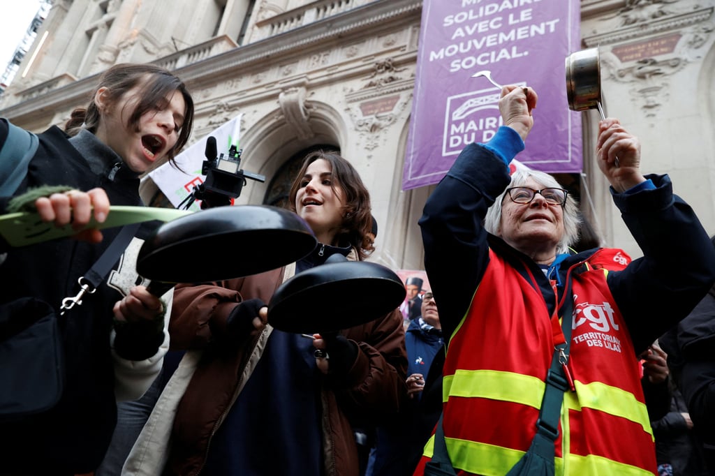 Protesters bang on a pots and pans during demonstration in Paris on Monday following a special address to the nation by French President Emmanuel Macron. Photo: Reuters