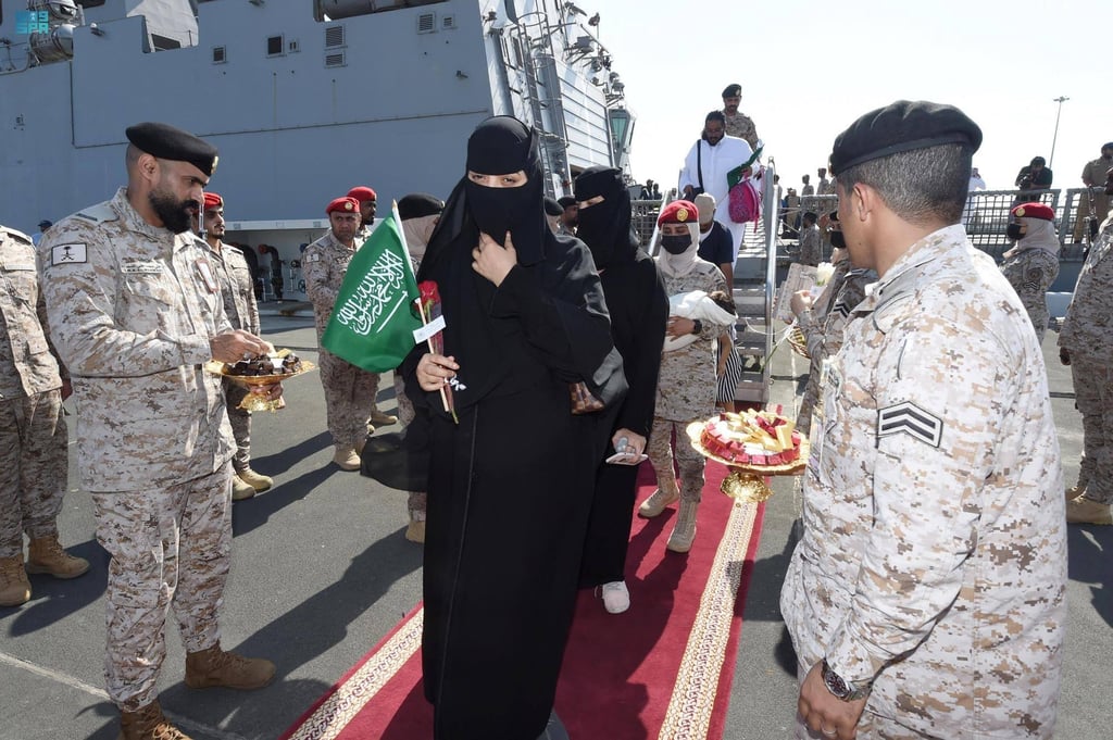 Members of the armed forces pass out chocolates and flowers to Saudi citizens and other nationals upon their arrival in Jeddah, Saudi Arabia following their rescue from Sudan on Saturday. Photo: SPA / AFP Members of the armed forces pass out chocolates and flowers to Saudi citizens and other nationals upon their arrival in Jeddah, Saudi Arabia following their rescue from Sudan on Saturday. Photo: SPA / AFP