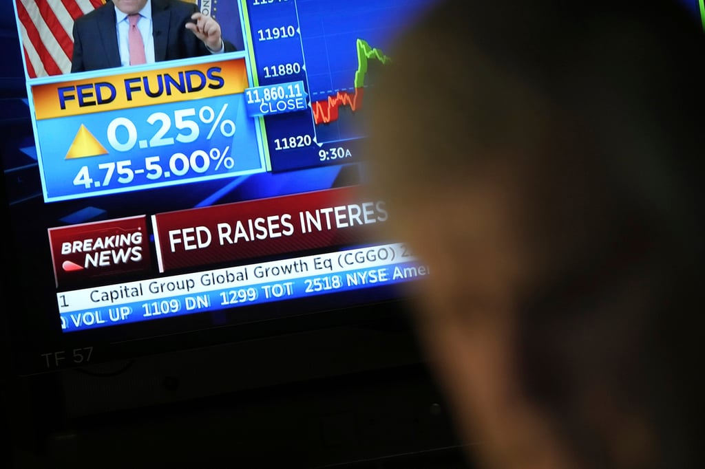 Traders monitor news on the Federal Reserve hiking interest rates on March 22. Photo: AP Photo Traders monitor news on the Federal Reserve hiking interest rates on March 22. Photo: AP Photo