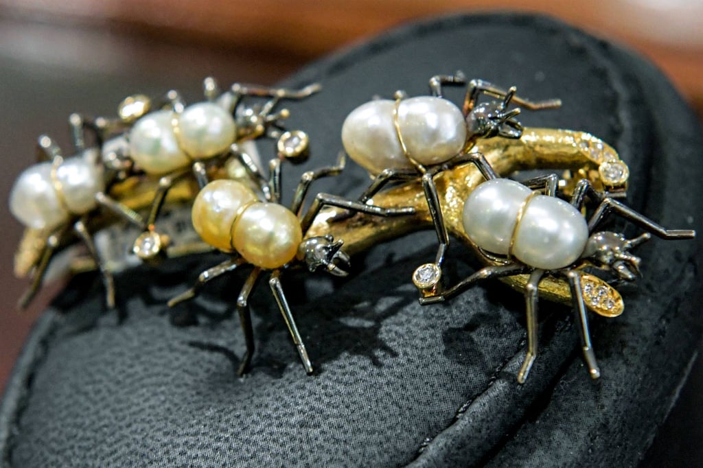 An ant-shaped brooch made of natural pearls and 18k yellow gold on display at the House of Pearls shop in Manama, on February 2.