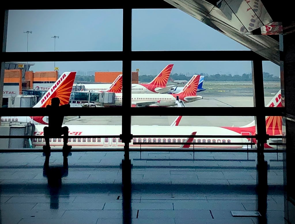 Local law enforcement met the flight at Indira Gandhi International Airport in New Delhi due to the disruption on board, American Airlines said. Photo: AP Local law enforcement met the flight at Indira Gandhi International Airport in New Delhi due to the disruption on board, American Airlines said. Photo: AP