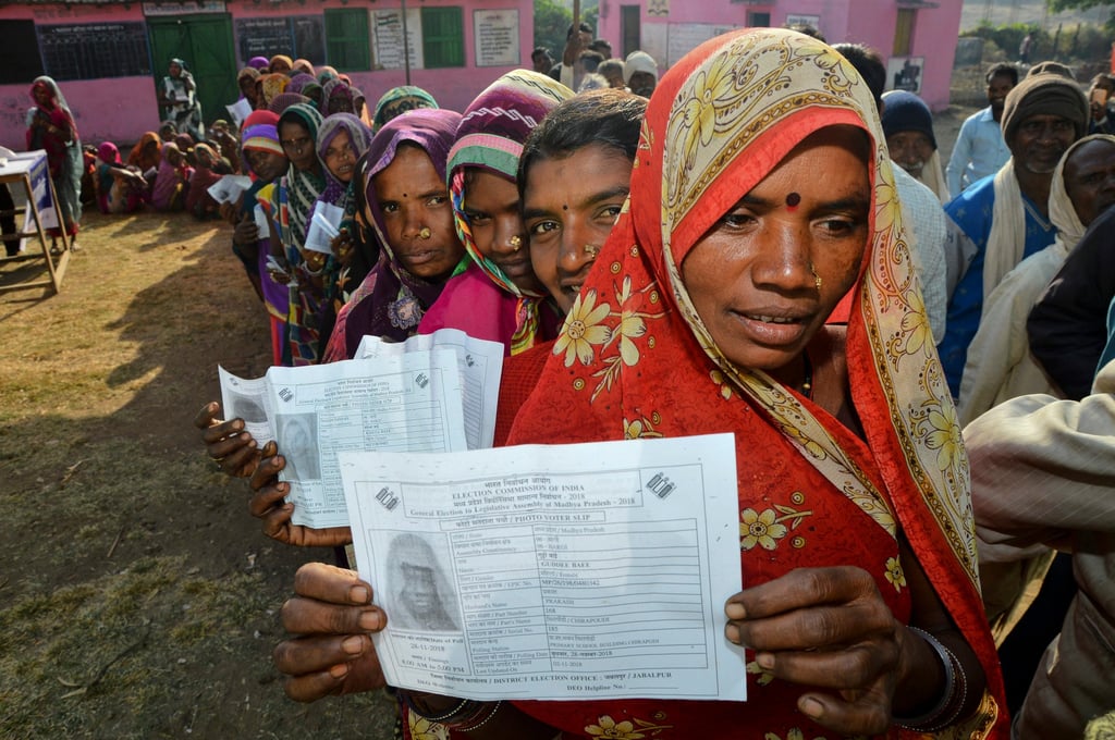 India’s “Gond” tribal women display their voter slips in 2018. Photo: AP