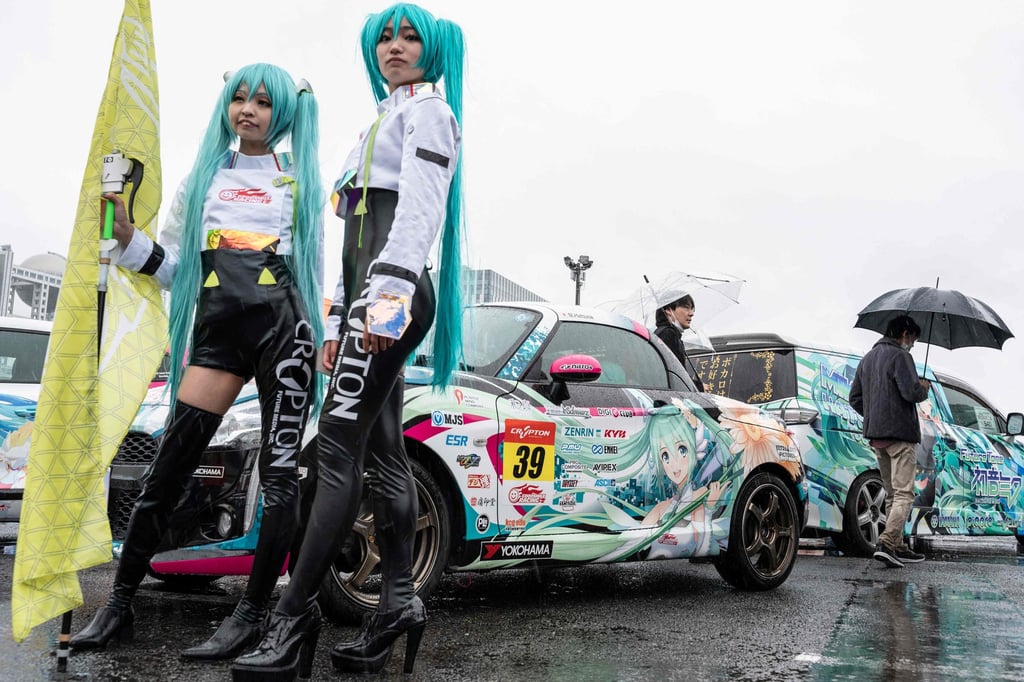 Cosplayers pose in front of a car during Itasha Tengoku, an annual show where cars decorated with various images and characters from anime and manga are put on display. Photo: AFP Cosplayers pose in front of a car during Itasha Tengoku, an annual show where cars decorated with various images and characters from anime and manga are put on display. Photo: AFP