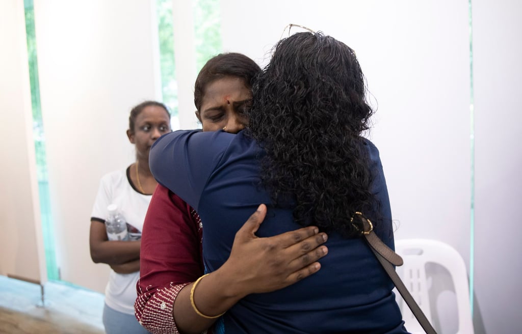 Leela, Tangaraju Suppiah’s sister, is hugged by a supporter earlier this month before her brother’s execution for conspiring to smuggle cannabis. Photo: EPA-EFE Leela, Tangaraju Suppiah’s sister, is hugged by a supporter earlier this month before her brother’s execution for conspiring to smuggle cannabis. Photo: EPA-EFE