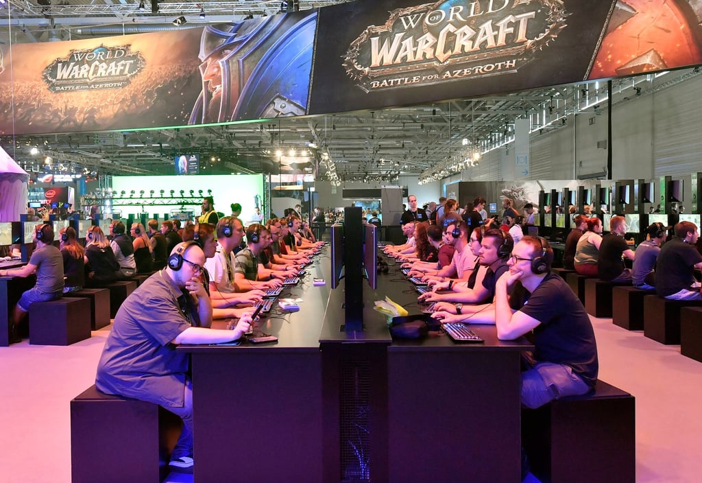 Visitors try out the latest World of Warcraft video game at the Gamescom fair for computer games in Cologne, Germany, on August 21, 2018. Photo: AP Photo