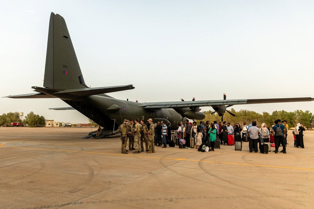 British nationals board an RAF aircraft, after being evacuated in Khartoum, Sudan. Photo: Reuters