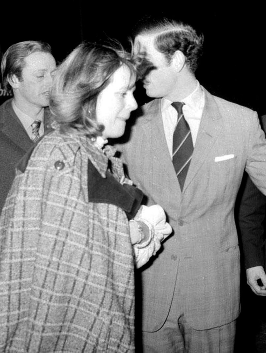 Camilla Parker Bowles (centre) and her then-husband Andrew Parker Bowles (left) leave the New London Theatre with the then-Prince of Wales (right), in 1975. Photo: AP
