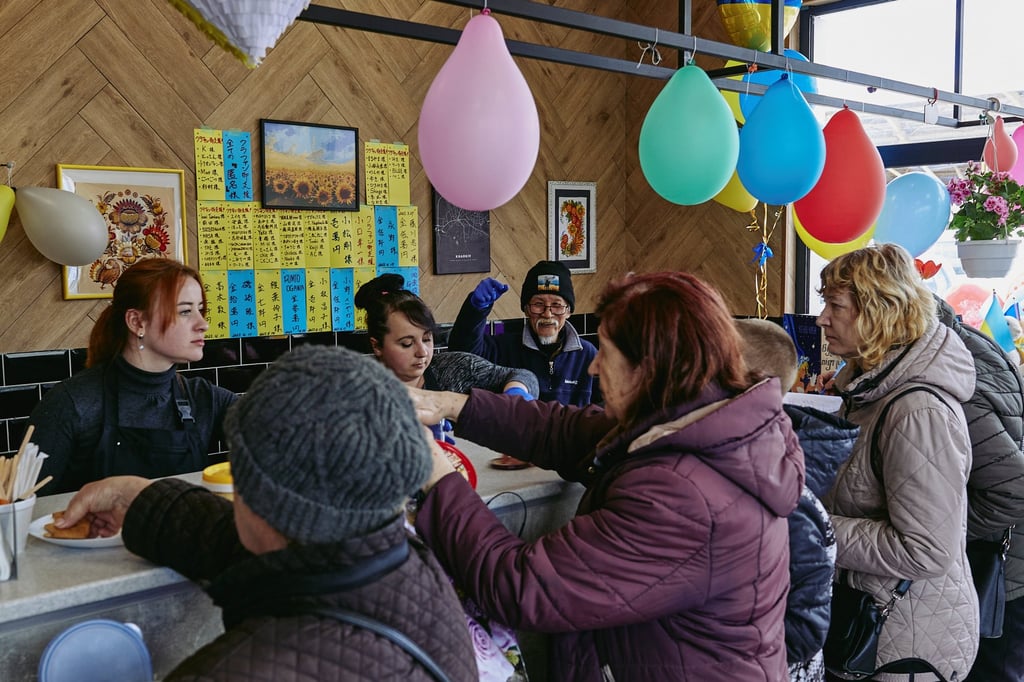 Fuminori Tsuchiko gives out free food to people at his cafe in Kharkiv on Monday. Photo: Reuters Fuminori Tsuchiko gives out free food to people at his cafe in Kharkiv on Monday. Photo: Reuters