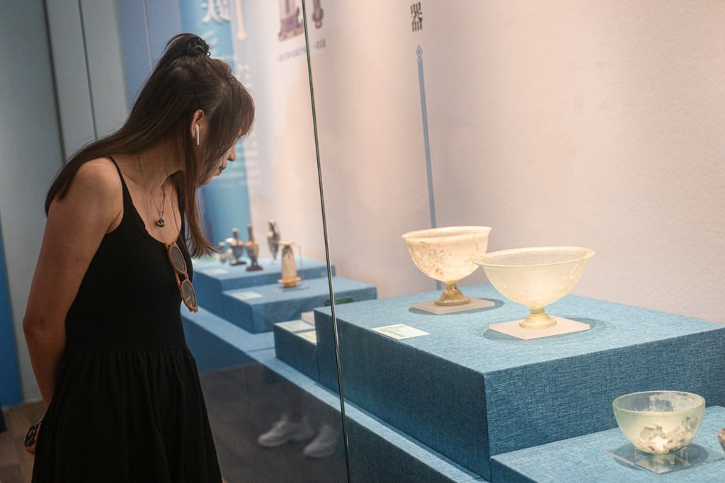 A visitor explores an exhibition titled ‘Lustrous Translucent Glass – Ancient Glass Art along the Silk Road’ at Hainan Museum in Haikou, capital of Hainan Province, on April 20, 2023. Photo: Xinhua A visitor explores an exhibition titled ‘Lustrous Translucent Glass – Ancient Glass Art along the Silk Road’ at Hainan Museum in Haikou, capital of Hainan Province, on April 20, 2023. Photo: Xinhua