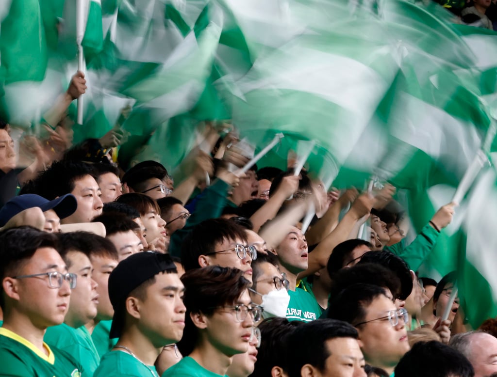 Beijing Guoan fans watch their side’s home game against Shandong Taishan at Workers’ Stadium. Photo: Xinhua