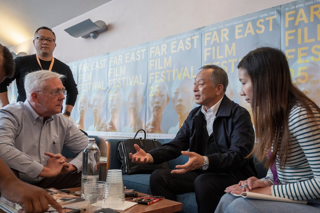 To (centre) at the 2023 Far East Film Festival with Post contributor Daniel Eagan (left), translator Heidi Li (right) and To’s brother To Kei-chi (back). Photo: Alice BL Durigatto