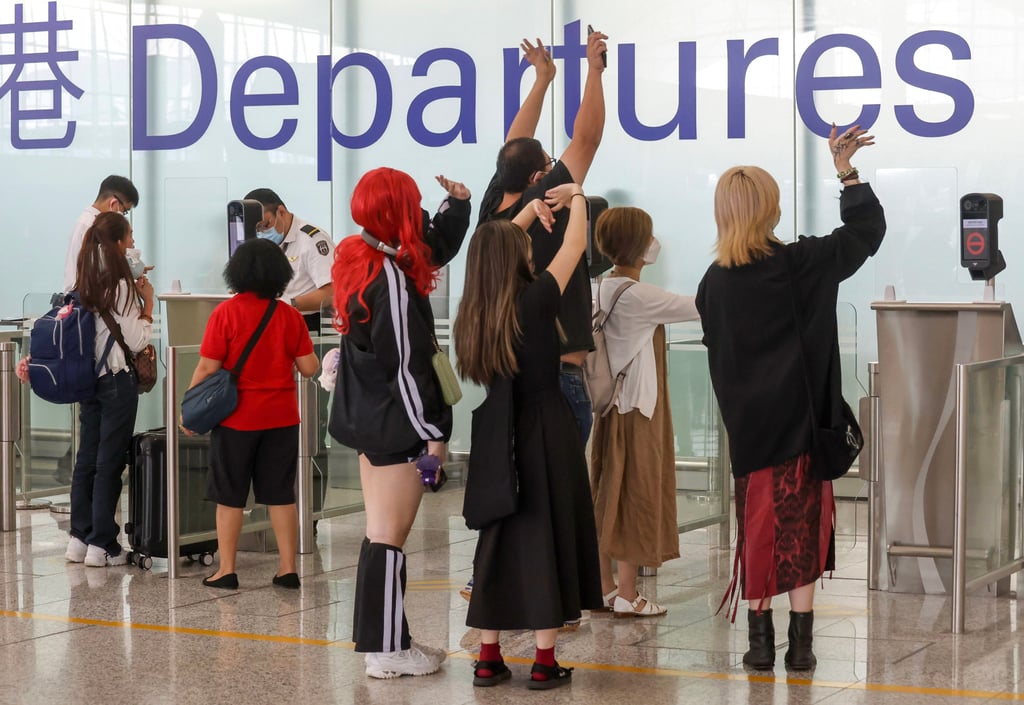 People bid farewell to friends and loved ones at Hong Kong International Airport. Photo: Jonathan Wong People bid farewell to friends and loved ones at Hong Kong International Airport. Photo: Jonathan Wong