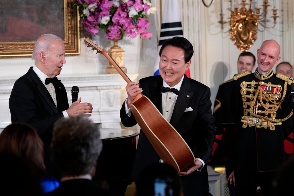 President Joe Biden surprised South Korea’s President Yoon Suk-yeol with a guitar signed by Don McLean. American Pie, by McLean, is one of Yoon’s favourite songs. Photo: AP President Joe Biden surprised South Korea’s President Yoon Suk-yeol with a guitar signed by Don McLean. American Pie, by McLean, is one of Yoon’s favourite songs. Photo: AP