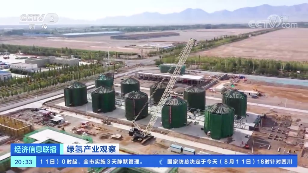 A view of an under construction “green hydrogen” factory in Xinjiang as part of China’s efforts to reduce carbon emissions. The project in Kuche project uses renewable energy sources, including photovoltaic and wind power, to produce hydrogen that can then be liquefied and transported long distances through natural gas pipelines and help tackle energy shortages in the most populated parts of the country. Photo: CCTV A view of an under construction “green hydrogen” factory in Xinjiang as part of China’s efforts to reduce carbon emissions. The project in Kuche project uses renewable energy sources, including photovoltaic and wind power, to produce hydrogen that can then be liquefied and transported long distances through natural gas pipelines and help tackle energy shortages in the most populated parts of the country. Photo: CCTV