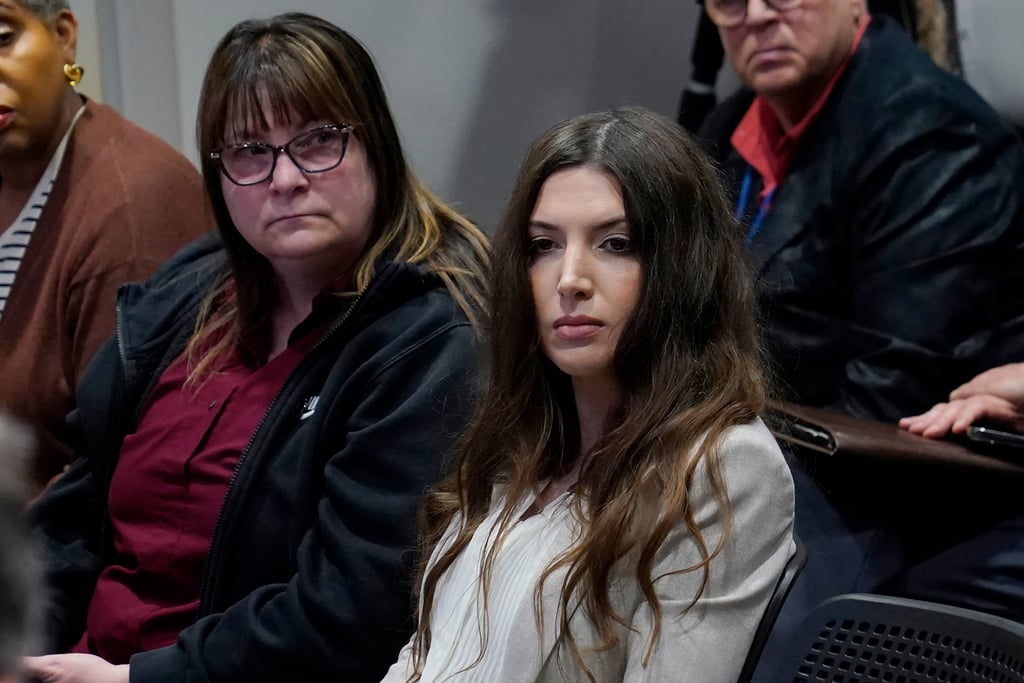 Lea Glossip (right), wife of death row inmate Richard Glossip, listens with anti-death penalty advocate Sue Hosch during a news conference in Oklahoma City on Thursday. Photo: AP