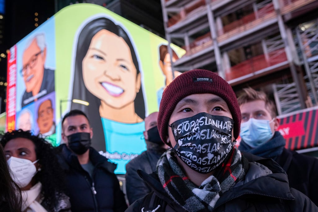 A person wearing a face mask reading, “Stop Asian Hate,” attends a candlelight vigil in honor of Michelle Alyssa Go, a victim of a subway attack in January. Photo: AP A person wearing a face mask reading, “Stop Asian Hate,” attends a candlelight vigil in honor of Michelle Alyssa Go, a victim of a subway attack in January. Photo: AP