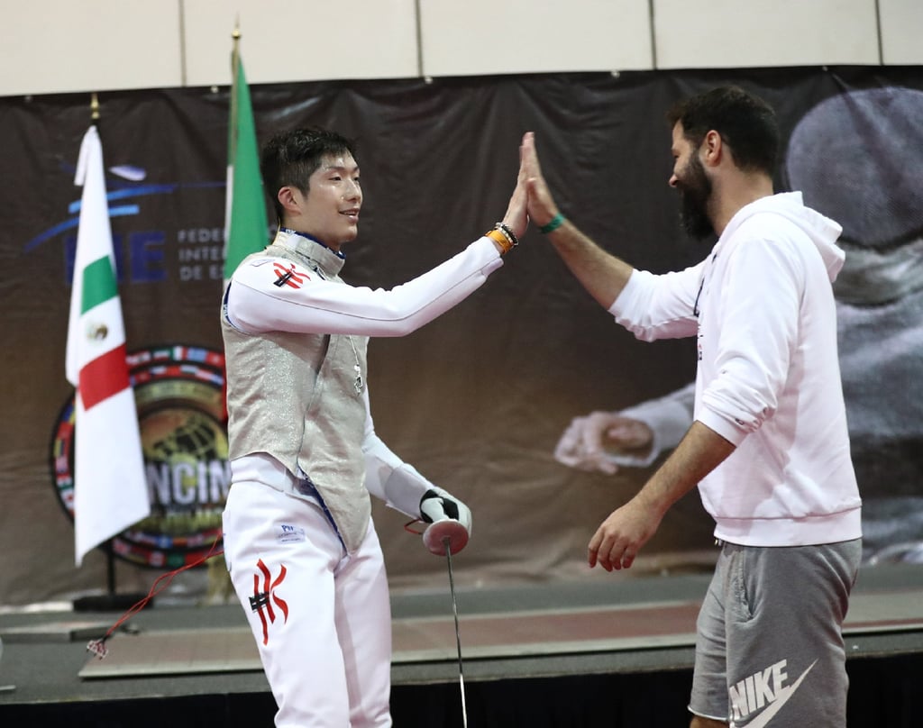 Cheung Ka-long celebrates with his coach Greg Koenig. Photo: FIE