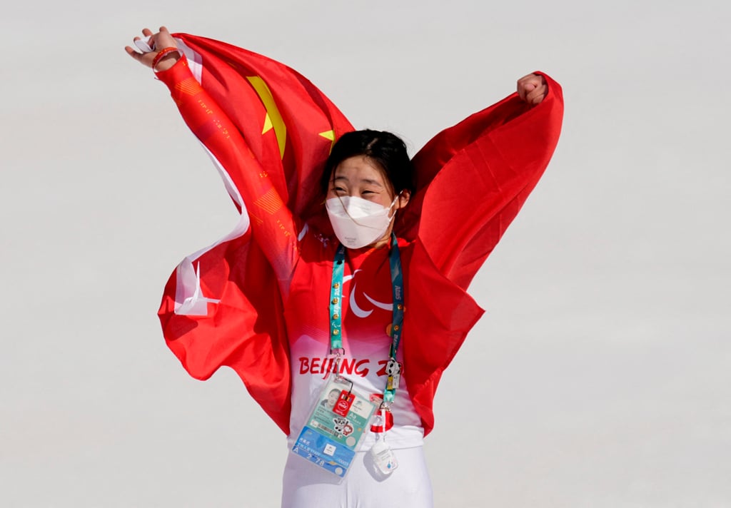 Zhang Mengqiu celebrates after winning the Women’s Super G Standing at Beijing 2022 Winter Paralympics. Photo: Reuters
