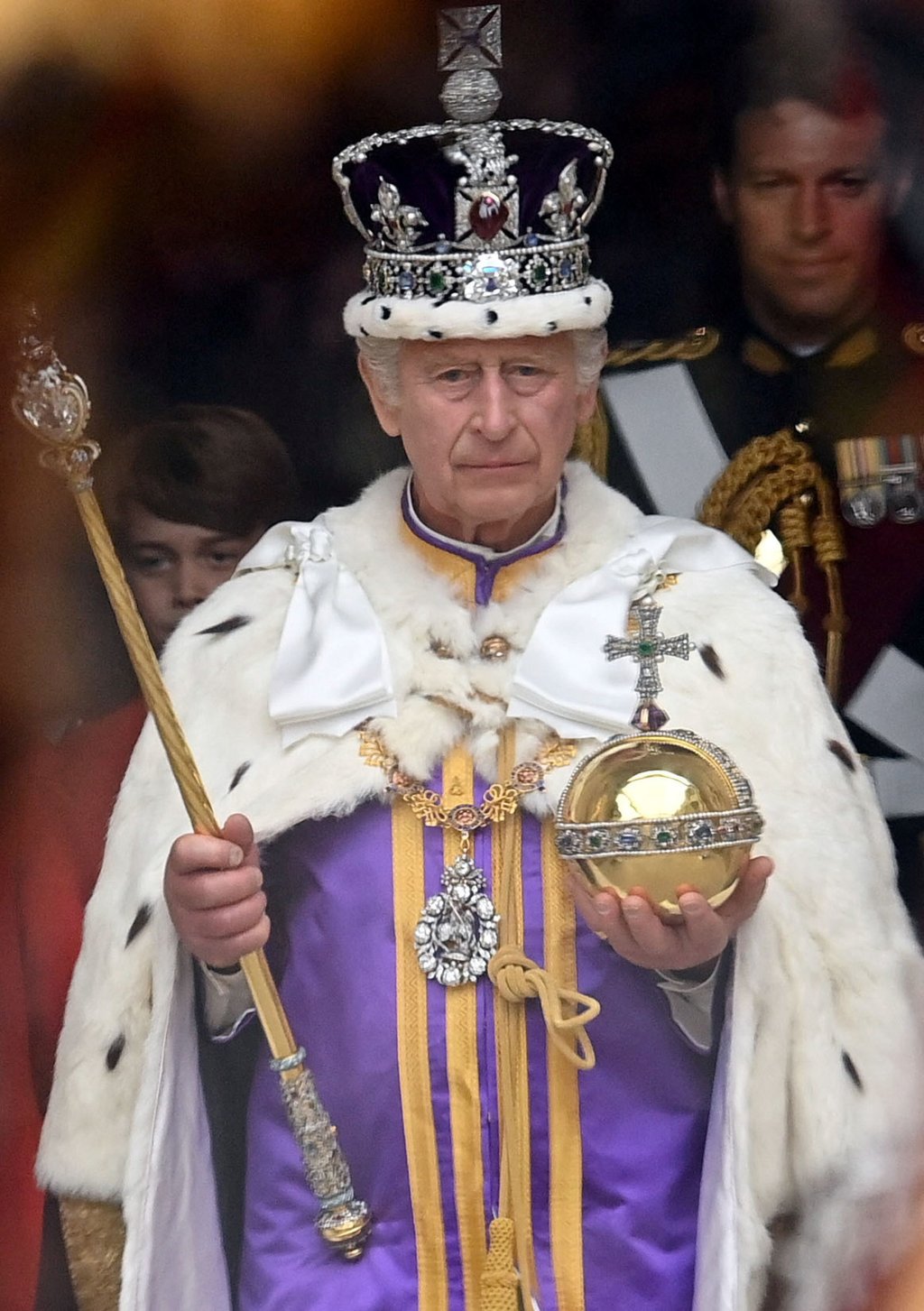 Britain’s King Charles III wearing the Imperial State Crown, and carrying the Sovereign’s Orb and Sceptre, leaves Westminster Abbey after the Coronation Ceremonies in central London, on May 6. Photo: Reuters