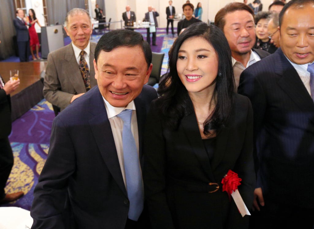 Former Thai prime ministers Thaksin Shinawatra (left) and his sister Yingluck Shinawatra at an event in Tokyo in 2018. Photo: Asahi Shimbun/AFP