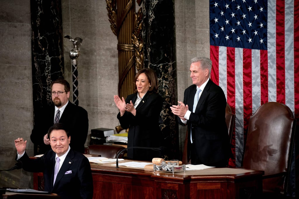 South Korean President Yoon Suk-yeol waves as US Vice-President Kamala Harris and House Speaker Kevin McCarthy applaud during his address to Congress in Washington on April 27. Photo: via Getty Images