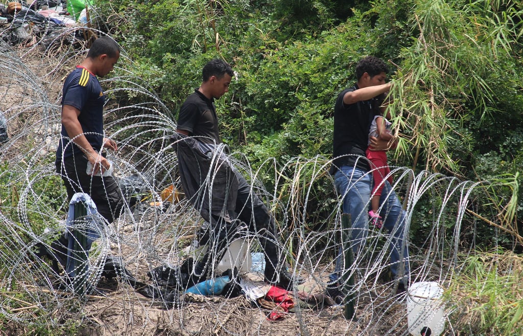 Migrants cross at the Rio Grande in Matamoros, Mexico on Thursday to try to enter the US. Photo: EPA-EFE
