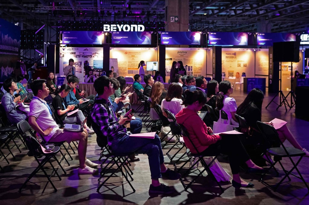 Visitors attend a talk during the Beyond Expo tech conference in Macau on May 10. Photo: AFP