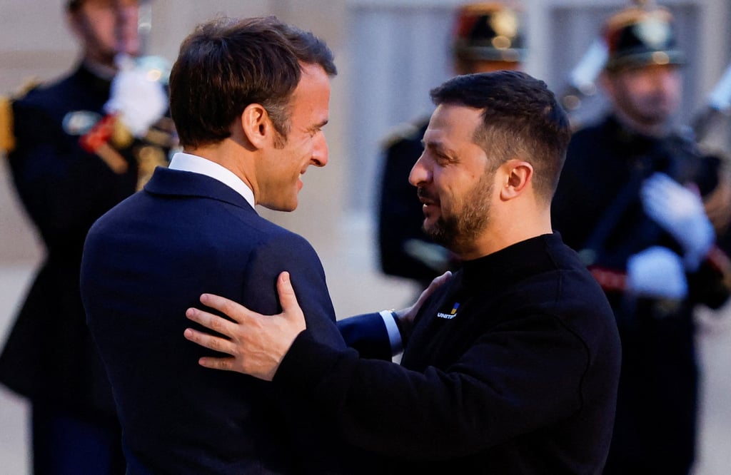 French President Emmanuel Macron, left, welcomes Ukraine’s President Volodymyr Zelensky at the Elysee Palace in Paris, France on Sunday. Photo: Reuters