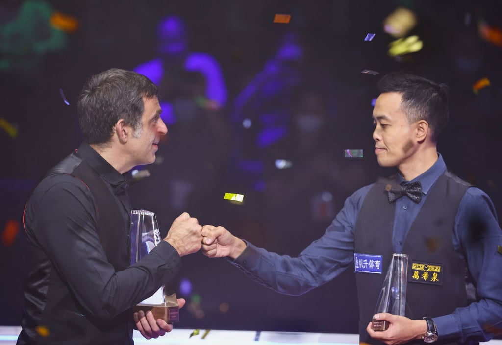 Winner Britain’s Ronnie O’Sullivan (left) is congratulated by Hong Kong’s Marco Fu after last yer’s Hong Kong Masters final at the Hong Kong Coliseum. Photo: K. Y. Cheng