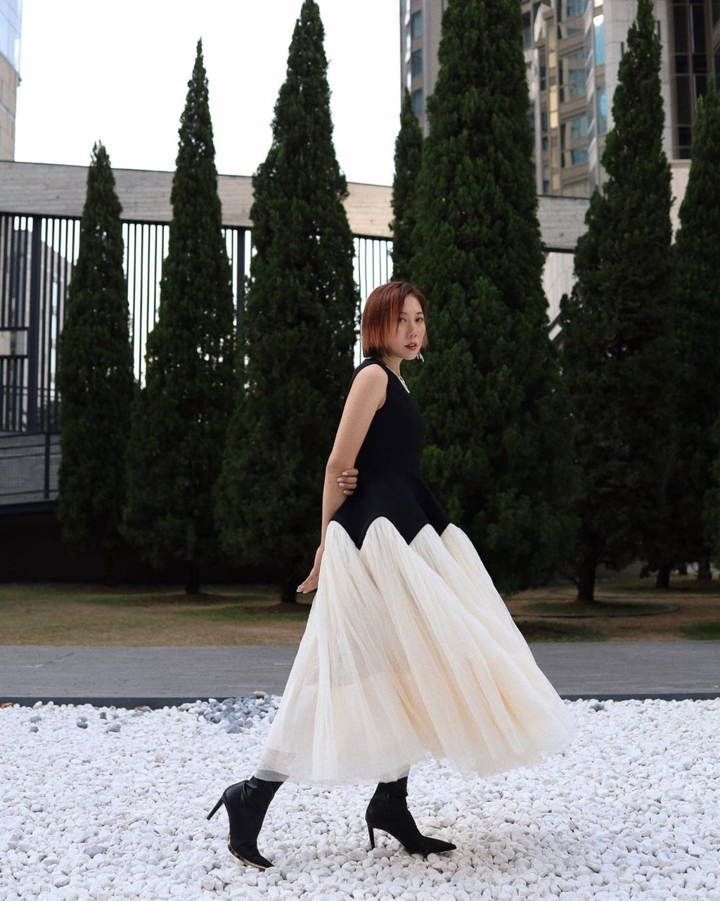 Faye Tsui wears a Tory Burch dress with Giuseppe Zanotti boots. Photo: @faye_tsui/Instagram Faye Tsui wears a Tory Burch dress with Giuseppe Zanotti boots. Photo: @faye_tsui/Instagram