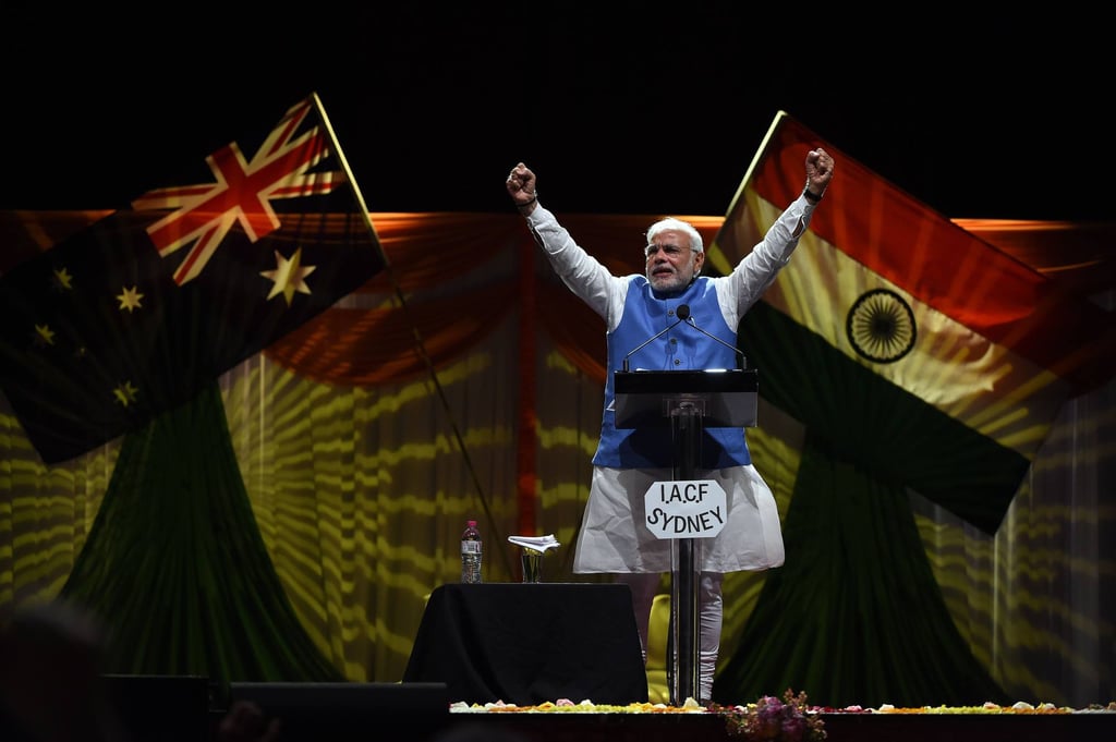 Modi gestures to the thousands of Indian community members who assembled at Sydney Olympic Park in 2014 to listen to India’s prime minister speak. Photo: AFP Modi gestures to the thousands of Indian community members who assembled at Sydney Olympic Park in 2014 to listen to India’s prime minister speak. Photo: AFP