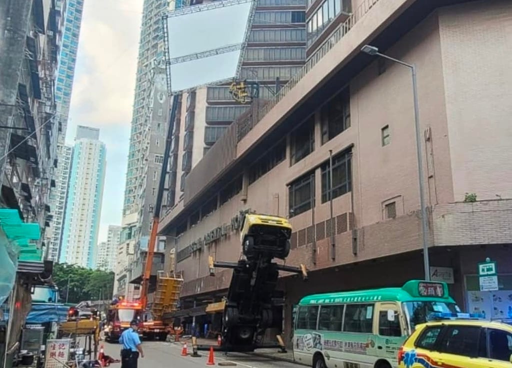 The truck tilted backwards, causing the workers to fall from the elevated platform. Photo: Handout The truck tilted backwards, causing the workers to fall from the elevated platform. Photo: Handout