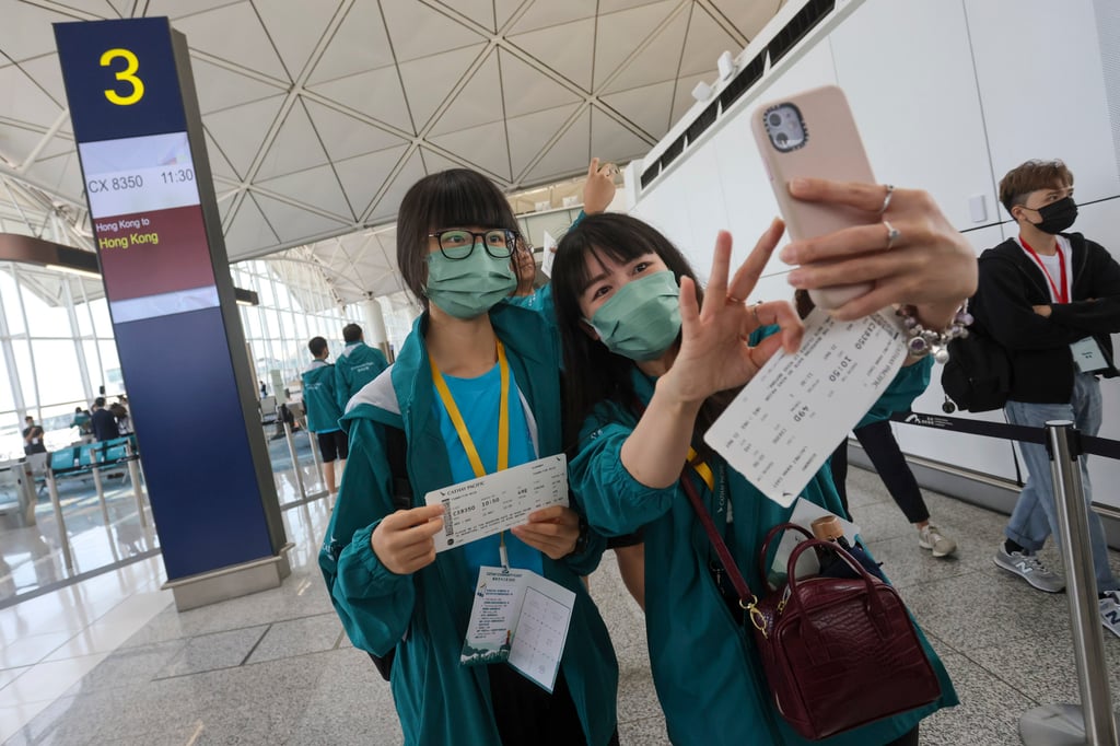 Programme participants at the airport with their boarding passes. Photo: Jonathan Wong