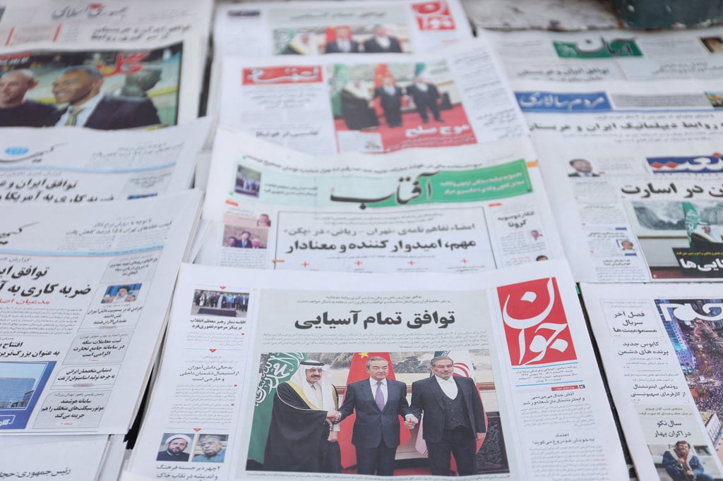 A newspaper with a cover picture of the Iran’s Ali Shamkhani, the secretary of the Supreme National Security Council and Saudi Minister of State and National Security Adviser Musaed bin Mohammed Al-Aiban, is seen in Tehran on Iran March 11, 2023. Photo: Reuters