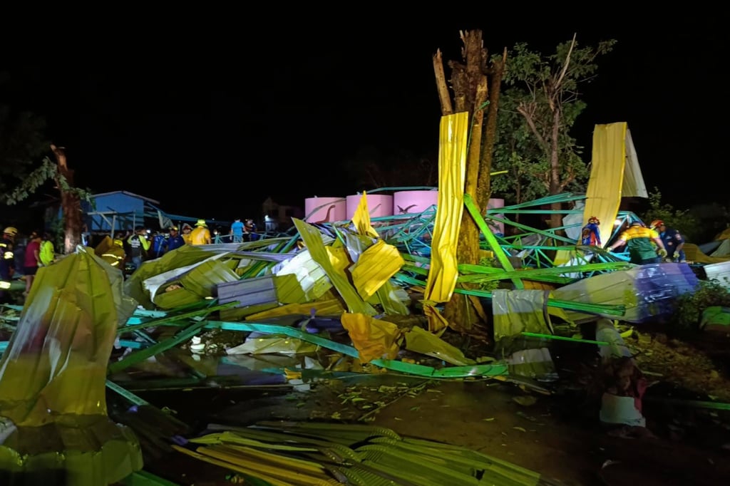 Thai rescuers at the scene of a collapsed roof at the Wat Nern Por primary school in Phichit province in northern Thailand. Photo: via AP Thai rescuers at the scene of a collapsed roof at the Wat Nern Por primary school in Phichit province in northern Thailand. Photo: via AP