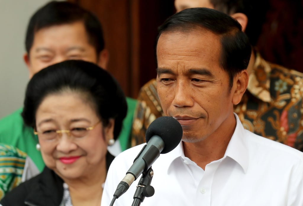Indonesian President Joko Widodo (R) talks to journalists accompanied by former Indonesian president Megawati Sukarnoputri (L) during a press conference in Jakarta in April 2019. Photo: EPA-EFE Indonesian President Joko Widodo (R) talks to journalists accompanied by former Indonesian president Megawati Sukarnoputri (L) during a press conference in Jakarta in April 2019. Photo: EPA-EFE