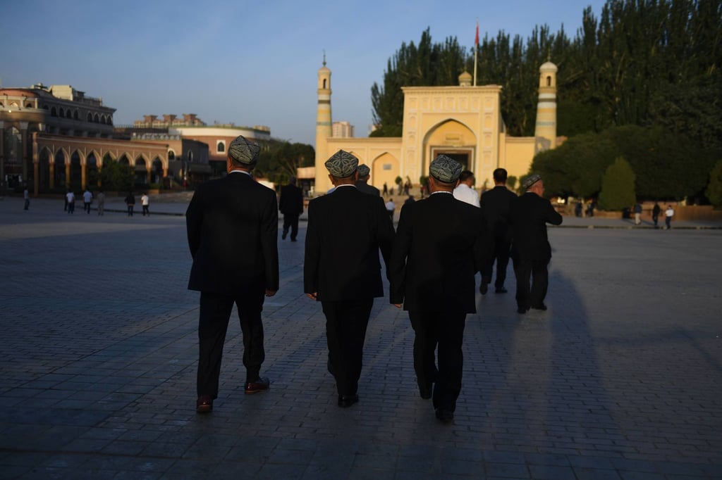 The faithful arrive for prayers at the Id Kah Mosque in Kashgar. Photo: AFP The faithful arrive for prayers at the Id Kah Mosque in Kashgar. Photo: AFP