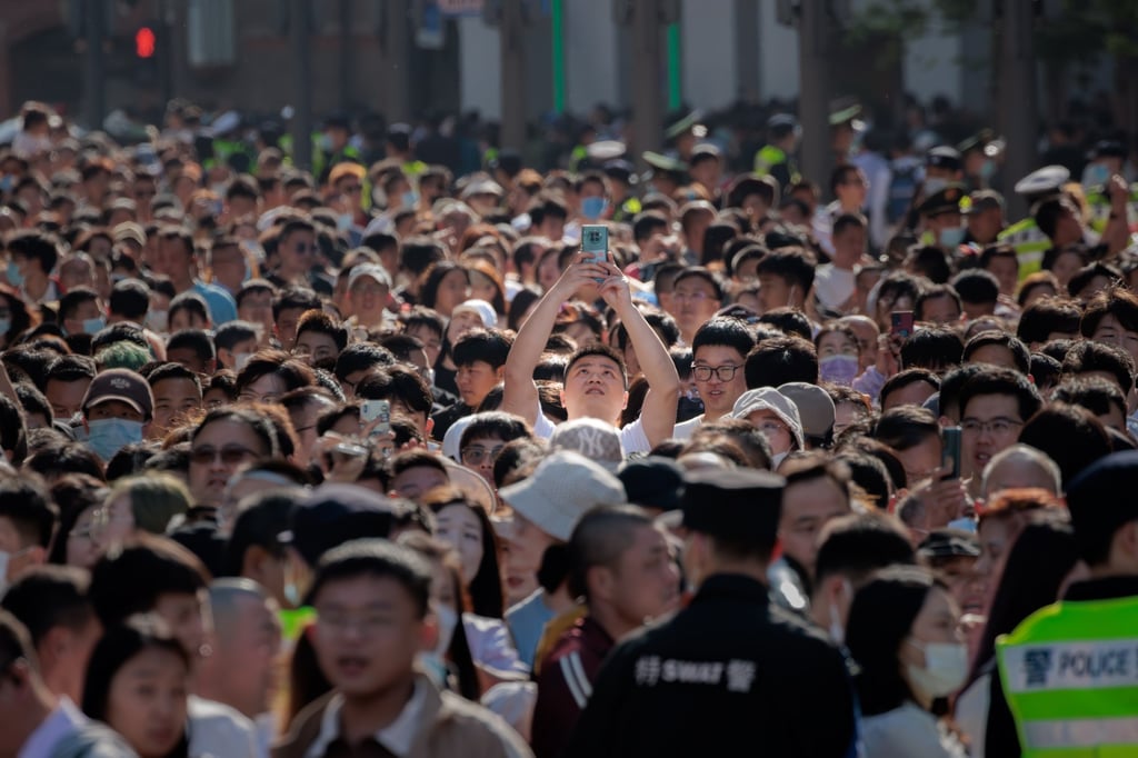 People walk in Nanjing Street, the main shopping and tourist area in Shanghai, China, during the golden week holiday on May 1, 2023. Photo: EPA-EFE