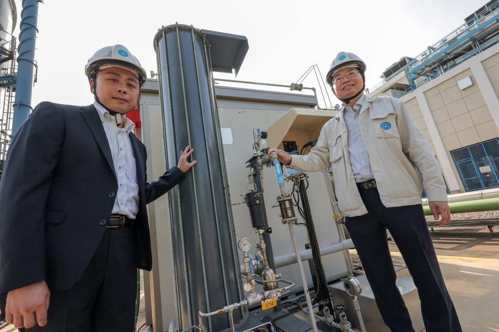 Don Cheng (left) and Stephen Chan of Towngas unveil the technology used to extract pure hydrogen to fuel heavy vehicles from coal gas. Photo: Jelly Tse