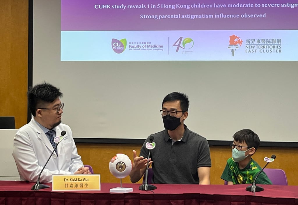 Wan To-hung (centre) who has astigmatism, and son Elon, seven, who was found to have the condition in 2021, with Chinese University’s Dr Kam Ka-wai. Photo: Emily Hung Wan To-hung (centre) who has astigmatism, and son Elon, seven, who was found to have the condition in 2021, with Chinese University’s Dr Kam Ka-wai. Photo: Emily Hung